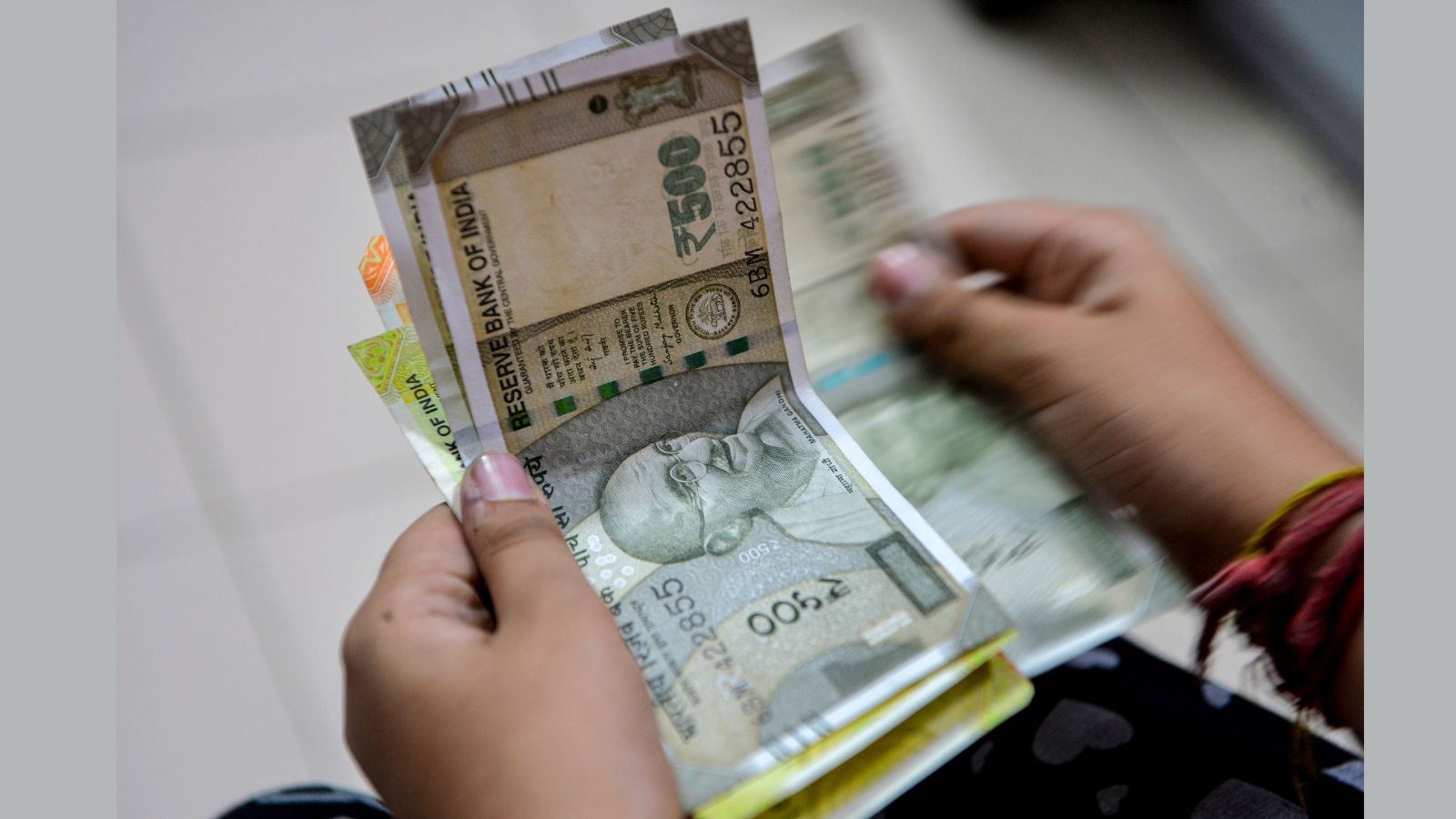 Rupee gains 12 paise to close at 95.31 against US dollar