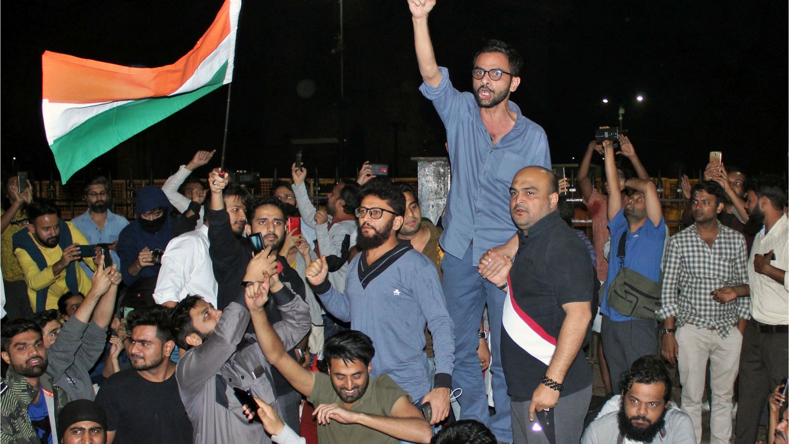 Umar Khalid along with other demonstrators raise slogans during a protest against the attacks on JNU students. File Photo: ANI