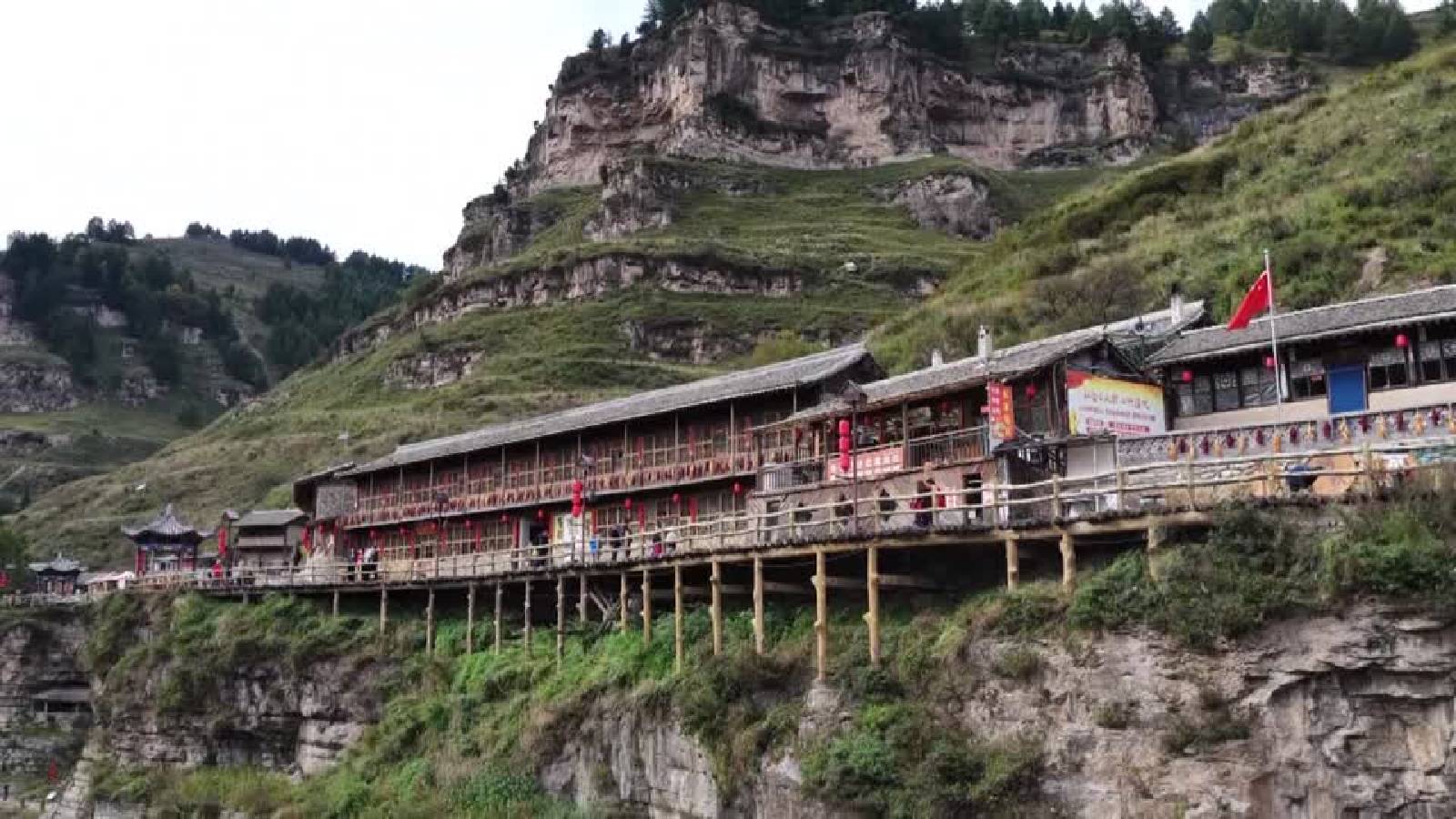 High in the mountains of northern China, a village appears to hang in the sky.