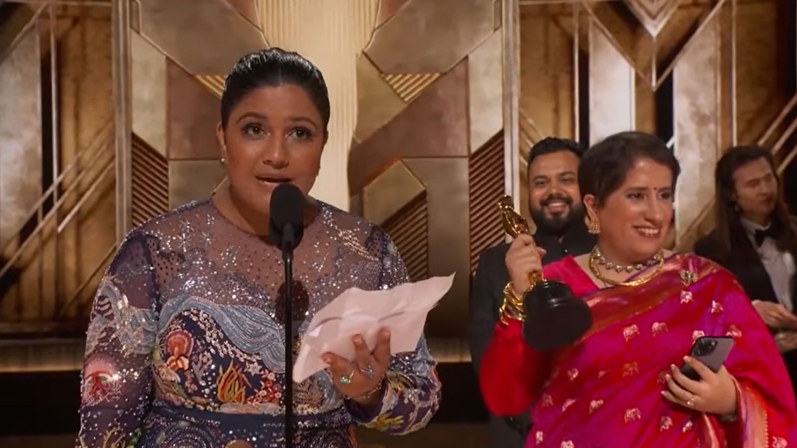 Kartiki Gonsalves and Guneet Monga receiving their Oscars at the 2023 Academy Awards. Photo: Screengrab via YouTube/@Oscars
