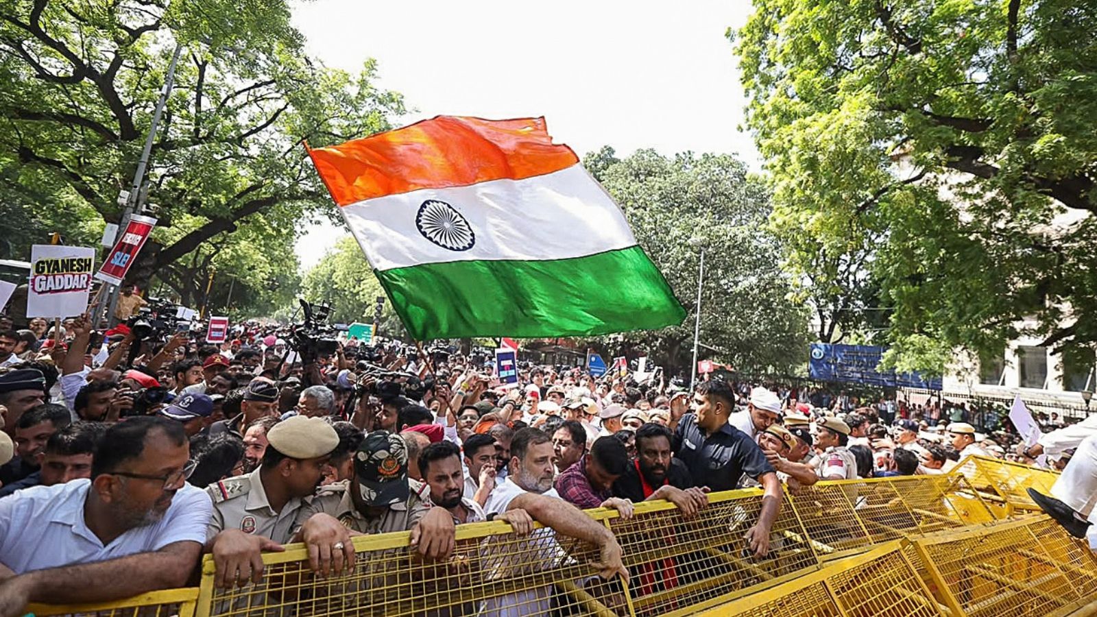 Lok Sabha LoP Rahul Gandhi and others stand behind security barricades as the INDIA bloc march to the Election Commission. Photo: ANI