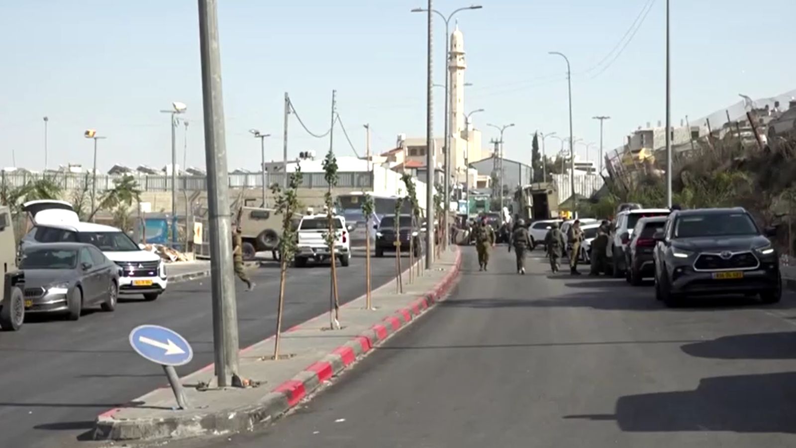 Israel imposes closures, evacuates residents in West Bank's Hebron after two soldiers killed