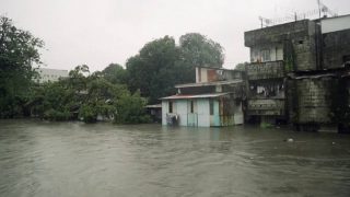 Monsoon rains flood Manila homes, submerge roads in northern Philippines