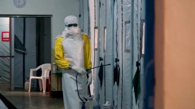 As Ebola deaths rise, burial teams face exhaustion and hostility on the front lines